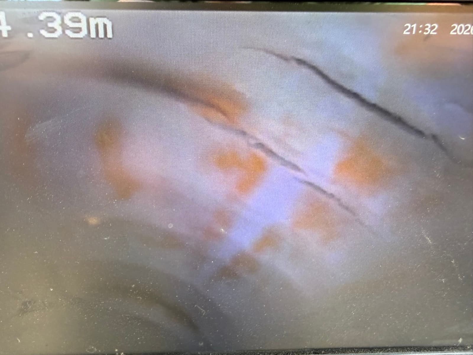 CCTV camera capturing a cracked pipe underground